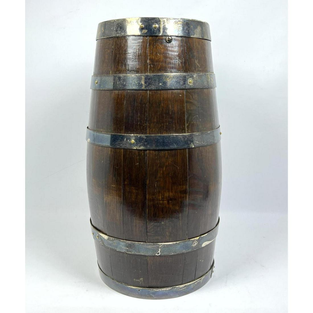 Slatted Wood Barrel Umbrella Stand with Metal Straps. A: Slatted Wood Barrel Umbrella Stand with Metal Straps. Antique. Probably English. Dimensions: H: 20 inches: W: 10 inches: D: 10 inches ---