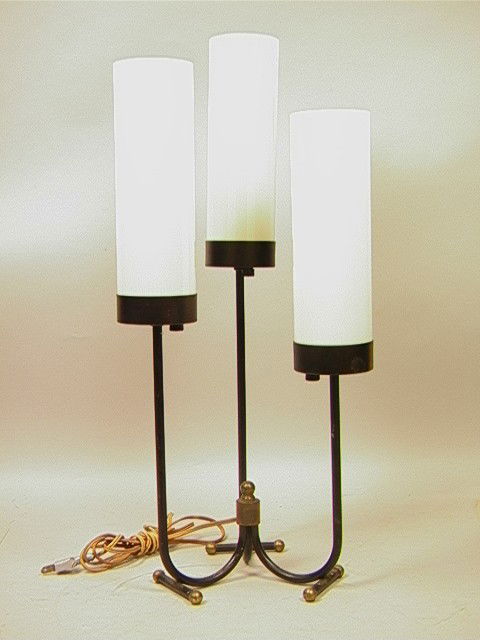 Modernist JACQUES ADNET style Iron Table Lamp wit: Modernist JACQUES ADNET style Iron Table Lamp with 3 cylinder glass shades. Brass feet caps.-- Dimensions: H: 23 inches: W: 11 inches --- Condition (General): Loss to black paint and rust. Please cont