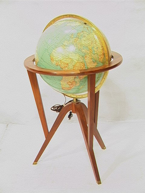 EDWARD WORMLEY for DUNBAR World Globe Stand. Wal: EDWARD WORMLEY for DUNBAR World Globe Stand. Walnut Stand with brass capped feet. Light up Globe. Unmarked.-- Dimensions: H: 35 inches: W: 20.5 inches --- Condition (General): Very Good Condition. Min
