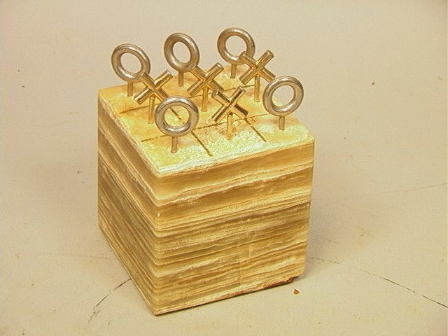 C JERE Agate and Metal Tic Tac Toe Sculpture. Ba: C JERE Agate and Metal Tic Tac Toe Sculpture. Banded Agate/Onyx Cube with Gold and Silver Metal X's & O's. Signed. & dated 72.-- Dimensions: H: 5 inches: W: 4 inches: D: 4 inches --- Condition (Genera