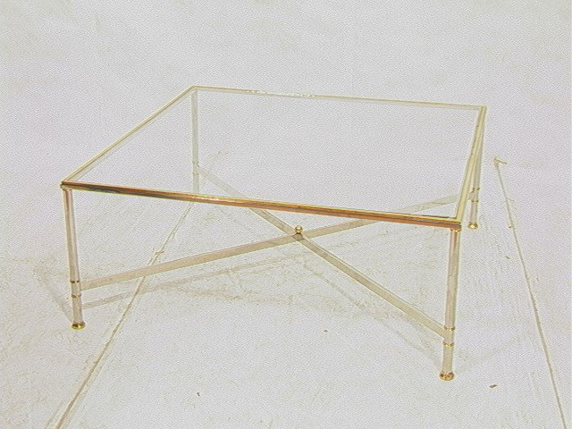 Oversized REGENCY style Cocktail Table. Large squ: Oversized REGENCY style Cocktail Table. Large square chrome brass glass top table. -- Dimensions: H: 17 inches: W: 42 inches: D: 42 inches --- Condition (General): Chips to glass. Minor loss to finish
