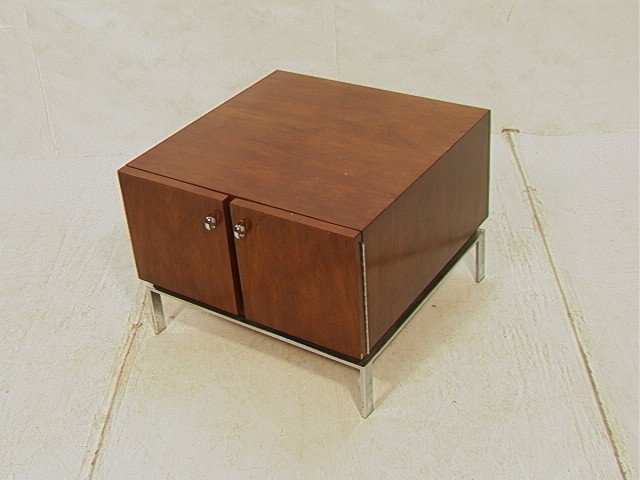 American Modern Walnut Occasional Table with two: American Modern Walnut Occasional Table with two doors. MILO BAUGHMAN style Chrome Base. -- Dimensions: H: 20 inches: W: 27 inches: D: 27 inches --- Condition (General): Scratches and blemishes to woo