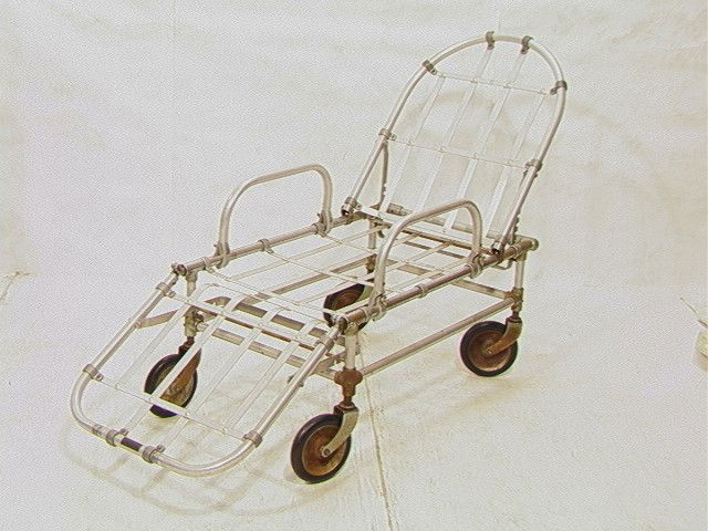 Aluminum & Steel Industrial Reclining Chaise Loun: Aluminum & Steel Industrial Reclining Chaise Lounge Gurney. Neat lines and form. On wheels. -- Dimensions: H: 38 inches: W: 22 inches: D: 62 inches --- Condition (General): Very Good Condition. Please
