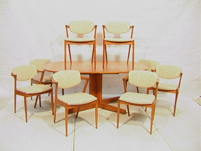 Danish Modern Teak Dining Set. Table & 8 Chairs: Danish Modern Teak Dining Set. Table & 8 Chairs with Arms. Eight Arm Chairs. Marked AM Denmark.-- Dimensions: --- Condition (General): Two small water stains to top. Minor rubs to edges. Few chairs ar