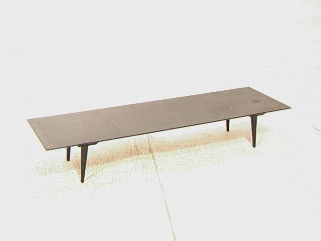 PAUL McCOBB Planner Group Low Coffee Table. Ebon: PAUL McCOBB Planner Group Low Coffee Table. Ebonized Finish Cocktail Table. Marked.-- Dimensions: H: 10 inches: D: 18 inches: L: 60 inches --- Condition (General): Lots of dings and scratches to finis