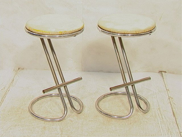 Pr GILBERT ROHDE Z Stool Chromed Steel Frame with: Pr GILBERT ROHDE Z Stool Chromed Steel Frame with Vinyl Upholstered Seat. These have foot rests. 2 PCS-- Dimensions: H: 24 inches: W: 15 inches --- Condition (General): Seats have been painted white.