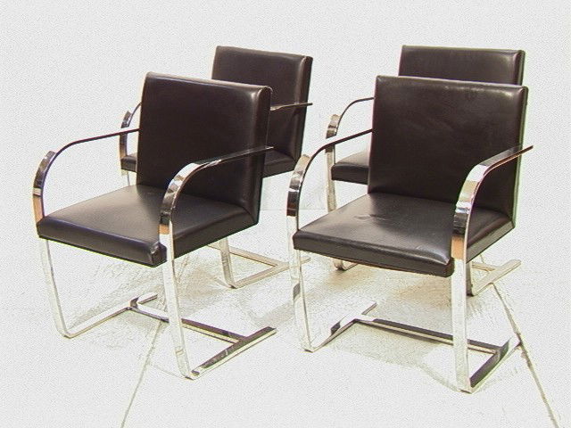 Mies Van der Rohe Set of 4 Brno Dining Chairs. Wi: Mies Van der Rohe Set of 4 Brno Dining Chairs. Wide Flat Chrome Frames with black leather seats and backs-- Dimensions: H: 31 inches: W: 23 inches: D: 22 inches --- Condition (General): A few scratche
