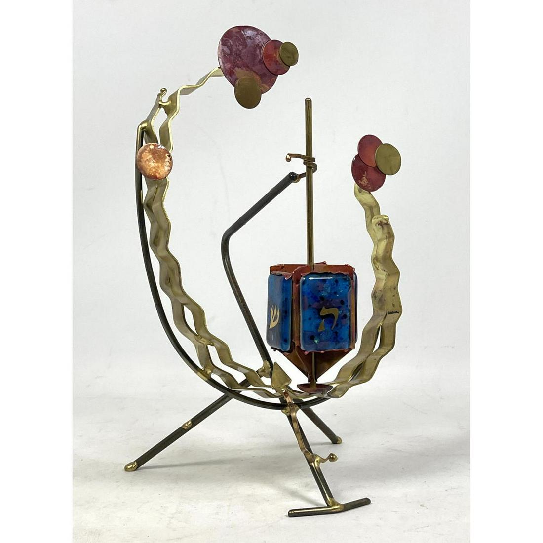 Mixed Metal Dichroic Glass Dreidel Sculpture. Artisan J: Mixed Metal Dichroic Glass Dreidel Sculpture. Artisan Judaica. Most likely Gary Rosenthal. Dimensions: H: 13 inches: W: 9 inches: D: 7 inches ---