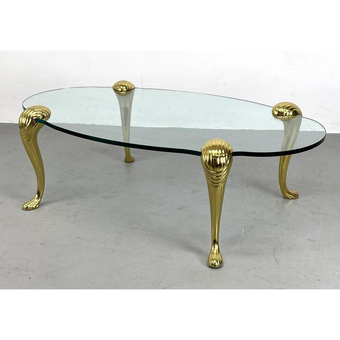 Brass and glass coffee table with .5 inch glass and rib: Brass and glass coffee table with .5 inch glass and ribbed brass Dimensions: H: 16 inches: W: 51 inches: D: 29.5 inches ---