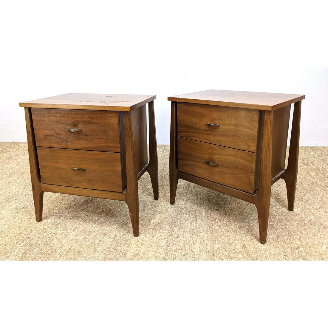 2pc American Modern Walnut Night Stands. Raised on exte: 2pc American Modern Walnut Night Stands. Raised on extended legs. Metal pulls Dimensions: H: 24 inches: W: 21 inches: D: 16 inches ---