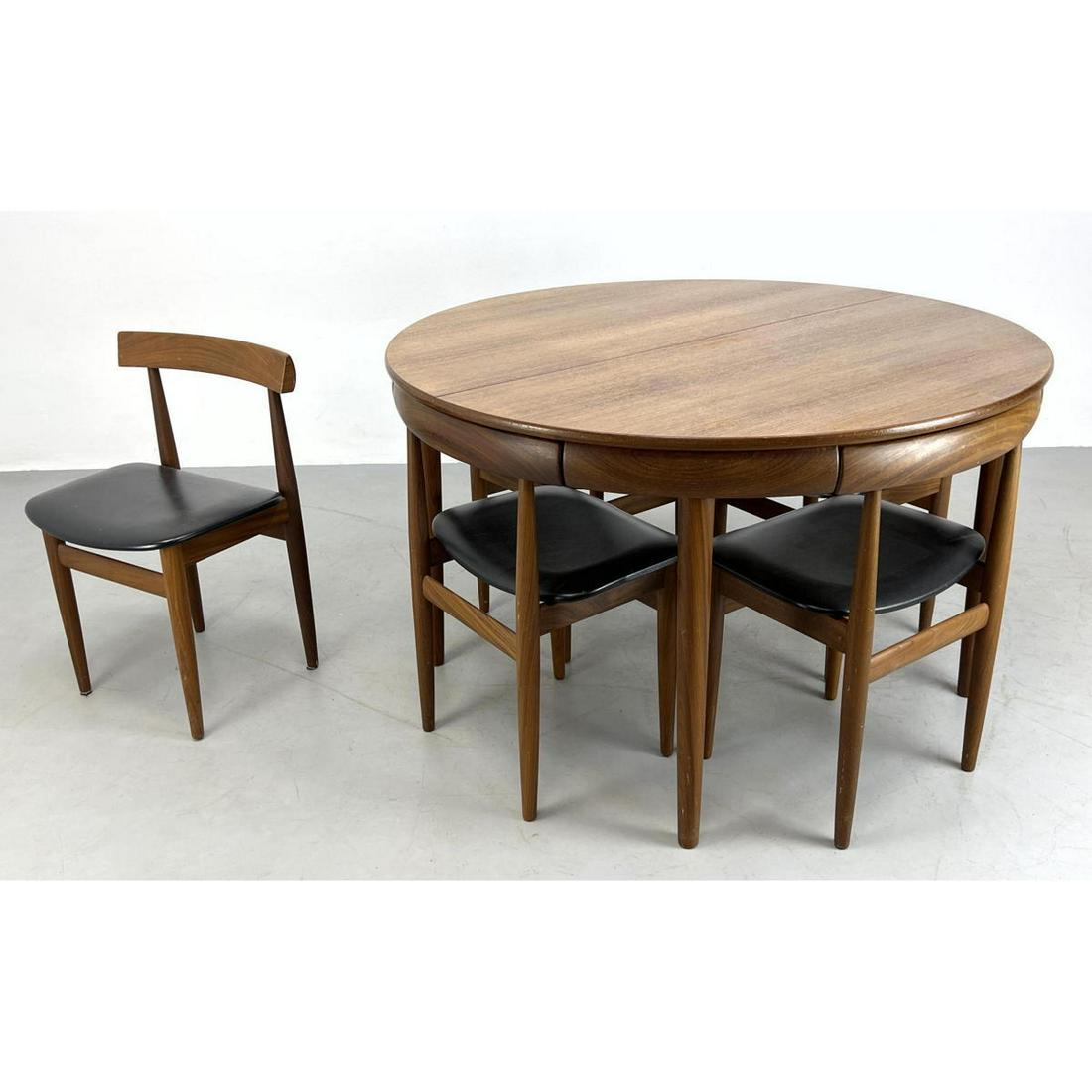 HANS OLSEN Dining Set for Frem Rojle teak hidden leaf d: HANS OLSEN Dining Set for Frem Rojle teak hidden leaf dining table with 4 nesting chairs (and one extra) Dimensions: H: 29.25 inches: W: 47.25 inches: D: 47.25 inches - Seat Height: 17 inches ---