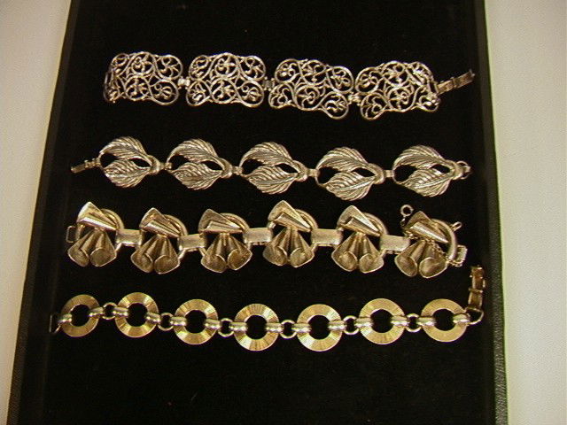 4 Vintage STERLING Bracelets: NAPIER, JEWEL ART.: 4 Vintage STERLING Bracelets: NAPIER, JEWEL ART. An Art Deco Modernist MONET JEWELERS Bracelet. A scroll design Bracelet.-- Dimensions: --- Weight: 4.33 Troy ozs. ---- --- US Shipping charge: $7