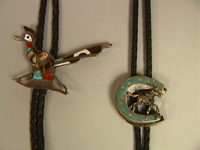 2 Native American Bolo Ties. One Silver Road Runn: 2 Native American Bolo Ties. One Silver Road Runner with Inlaid Stones and Abalone. One silvertone with Turquoise Enamel Horseshoe with Horse. Unmarked.-- Dimensions: --- US Shipping charge: $7