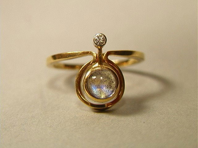 18K Gold Moonstone Diamond Modernist Ring. Marked: 18K Gold Moonstone Diamond Modernist Ring. Marked 750-- Dimensions: --- Weight: 3 DWT --- US Shipping charge: $7