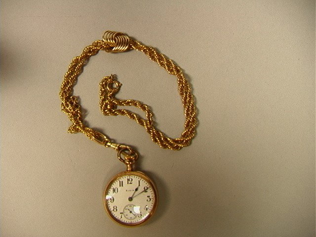 ELGIN Gold Fill Pocket Watch with G/F Rope Slide: ELGIN Gold Fill Pocket Watch with G/F Rope Slide Chain. With Fitted Velvet Box. Watch is 1.25"-- Dimensions: --- US Shipping charge: $7
