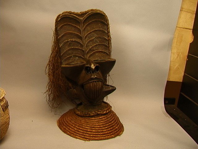 Ethnic bronze head with braid and grass type hair: Ethnic bronze head with braid and grass type hair and rattan collar.-- Dimensions: H: 25 inches: W: 16 inches --- US Shipping charge: Pick up or shipping quote from outside shipper, we cannot quote sh