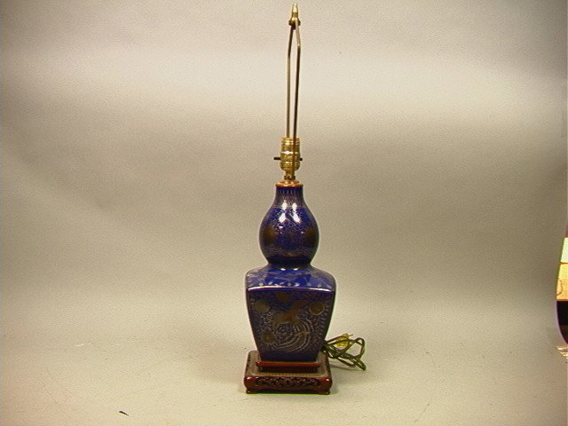 Asian Pottery Table Lamp with Silver Overlay Desi: Asian Pottery Table Lamp with Silver Overlay Design of flowers and bird.-- Dimensions: --- Condition (General): Pottery is 12 inches. Please contact us with specific questions about condition, not vis