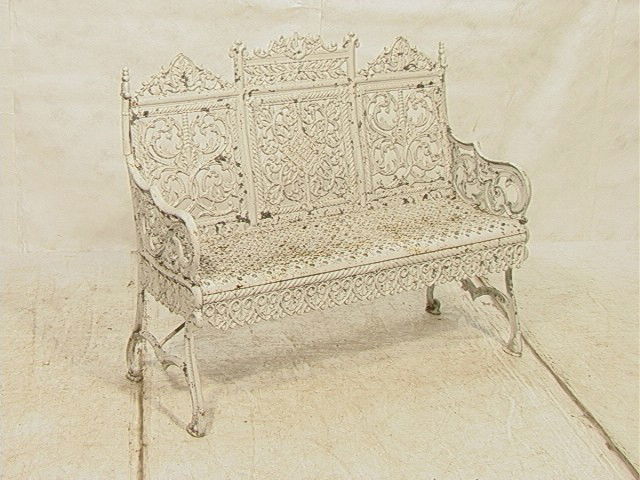 Cast Iron Cemetery Bench. Peter Timmes & Son. Pai: Cast Iron Cemetery Bench. Peter Timmes & Son. Painted White.-- Dimensions: H: 37 inches: W: 44 inches: D: 21 inches --- Condition (General): Lots of flakes to paint. Crackling causing paint loss. Crac