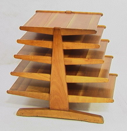 EDWARD WORMLEY for DUNBAR Magazine Table. Five ti: EDWARD WORMLEY for DUNBAR Magazine Table. Five tier graduated length shelves. Unmarked. -- Dimensions: H: 25 inches: W: 29 inches: D: 15.5 inches --- Condition (General): Some splits to wood at seams.