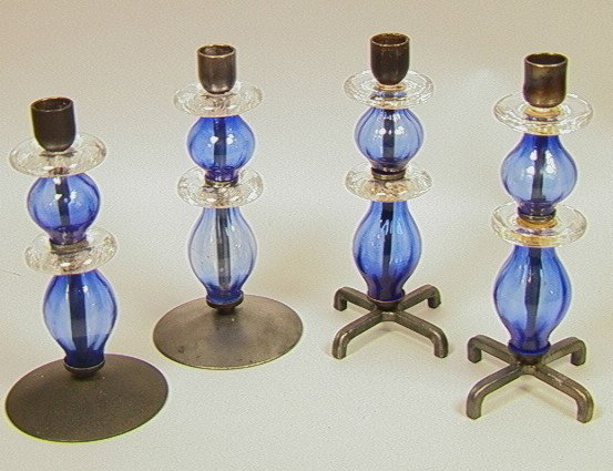 2 pr. ERIK HOGLUND For BODA Glass Metal Candlesti: 2 pr. ERIK HOGLUND For BODA Glass Metal Candlesticks. One pair with circular metal disc base. One pair with metal X base. Blue & Clear Glass. Metal on one pair marked BODA. -- Dimensions: H: 8.75 inch