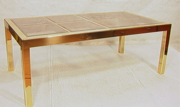 Mastercraft Dining Table. Brass Laminate Frame w: Mastercraft Dining Table. Brass Laminate Frame with Inset Beveled Glass. Two 19.5in Leaves. Smoked glass.-- Dimensions: H: 29.5 inches: W: 81 inches: D: 42.25 inches --- Condition (General): Very Good