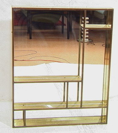 C Jere Brass and Mirror Wall Shelf Display. Signe: C Jere Brass and Mirror Wall Shelf Display. Signed C. Jere 1979-- Dimensions: H: 36 inches: W: 30 inches: D: 4.25 inches --- Condition (General): Some rust spots to metal. Please contact us with speci