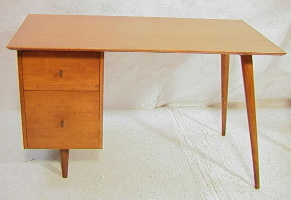 Paul McCobb Planner Group Desk. Maple with taper: Paul McCobb Planner Group Desk. Maple with tapered legs.-- Dimensions: H: 29 inches: W: 48 inches: D: 24 inches --- Condition (General): Long scratch to top. overall wear. Please contact us with speci