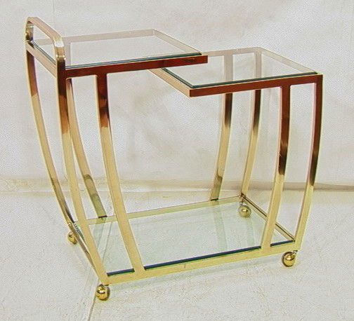 70's Modern Brass and Glass Tea Bar Cart Server.: 70's Modern Brass and Glass Tea Bar Cart Server. Inset Beveled Glass. -- Dimensions: H: 32.5 inches: W: 18 inches: D: 33.5 inches --- Condition (General): Some losses to brass finish. Please contact u
