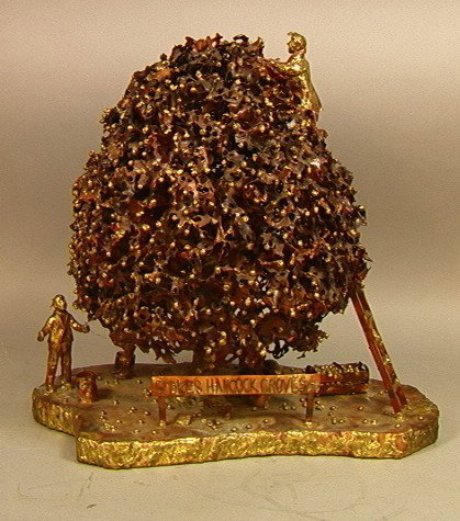STOKES HANCOCK GROVES LTD. Signed SHAW '89. Coppe: STOKES HANCOCK GROVES LTD. Signed SHAW '89. Copper & Brass Sculpture; Workers picking Fruit from Tree.-- Dimensions: H: 19 inches: W: 18 inches: D: 11 inches --- Condition (General): Very Good Conditi