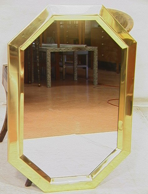 70's Modern Brass Framed Wall Mirror.: 70's Modern Brass Framed Wall Mirror. -- Dimensions: H: 36 inches: W: 24 inches --- Condition (General): Slight bend to one edge. Please contact us with specific questions about condition, not visible