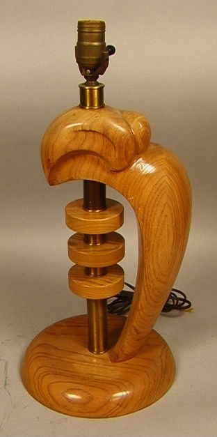 Wood Sculptural Table Lamp. Stylized Bird with Ce: Wood Sculptural Table Lamp. Stylized Bird with Central brass column. Unmarked. Style of Heifetz.-- Dimensions: H: 20 inches: W: 9 inches --- Condition (General): Some water spots to wood base. Please