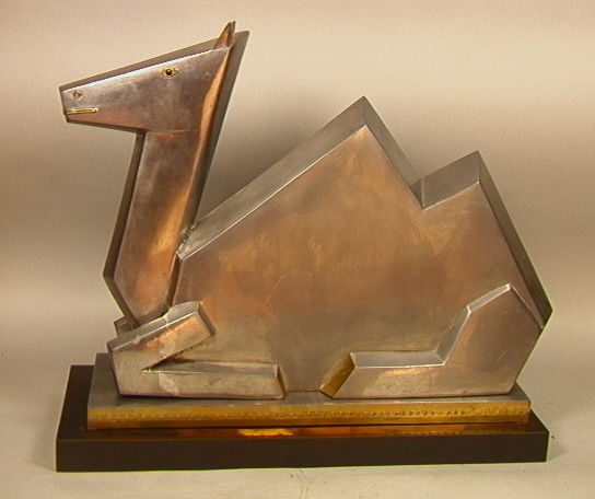Metal Camel Table Sculpture. Art Deco Minimalist: Metal Camel Table Sculpture. Art Deco Minimalist style Camel. Brass Accents.On Aluminum Base.-- Dimensions: H: 19 inches: W: 22 inches: D: 8.5 inches --- Condition (General): Very Good Condition. Plea