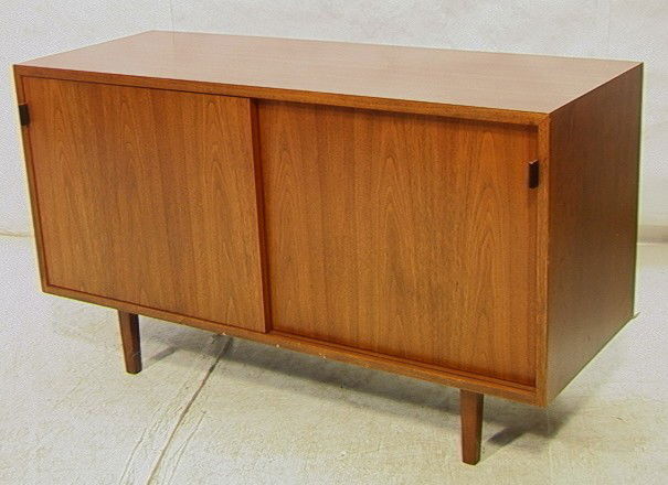 KNOLL Sliding Door Credenza. American Modern Waln: KNOLL Sliding Door Credenza. American Modern Walnut. Leather Pulls. Laminate Top. Interior fitted with drawers and shelves. Unmarked.-- Dimensions: H: 27.5 inches: W: 48 inches: D: 18 inches --- Condi