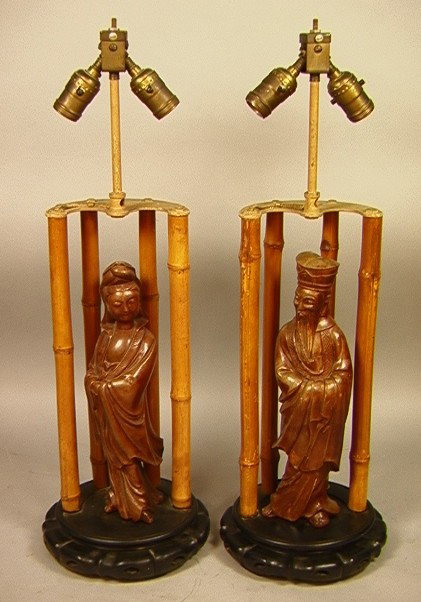 Pr JAMES MONT style Asian inspired Table Lamps. B: Pr JAMES MONT style Asian inspired Table Lamps. Bamboo Rods with Carved Wood Figures. -- Dimensions: H: 26 inches: W: 8 inches: D: 8 inches --- Condition (General): Cords have been cut. Need rewiring.