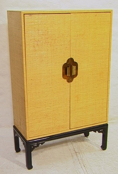 CARL SPRINGER inspired Grass Cloth Two Door Cabin: CARL SPRINGER inspired Grass Cloth Two Door Cabinet. Brass Handles. Shelf Interior. Not Marked.-- Dimensions: H: 56 inches: W: 33.5 inches: D: 16 inches --- Condition (General): Some dark spots to Gra