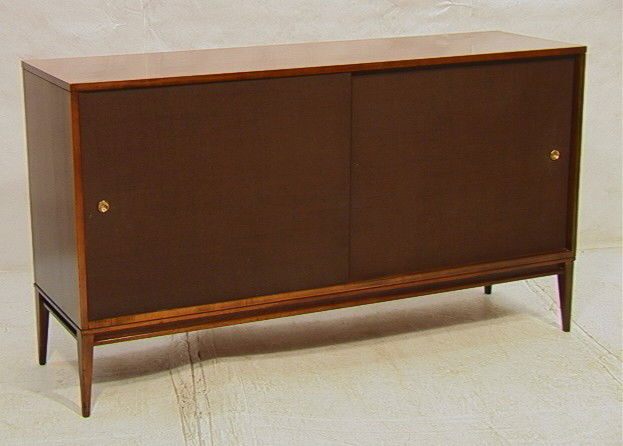 PAUL McCOBB Sliding Door Credenza Cabinet. PLANNE: PAUL McCOBB Sliding Door Credenza Cabinet. PLANNER Group. Woven Sliding Doors. Interior fitted with 3 drawers and shelves.-- Dimensions: H: 33.25 inches: D: 18.25 inches: L: 60 inches --- Condition (G