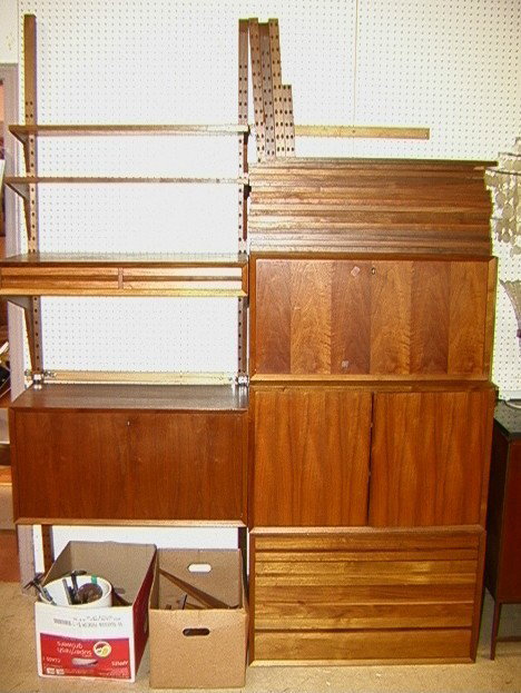 Danish Modern Teak Wall Unit. Desk, Cabinets, Sh: Danish Modern Teak Wall Unit. Desk, Cabinets, Shelves. Wall unit consists of 5 cabinets. One with 2 drawers. Two drop down cabinets with interior fittings. One two door unit. One 4 drawer unit. Large 