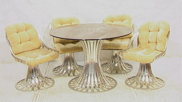 WOODARD Dinette Set. Table & 4 Chairs. Aluminum: WOODARD Dinette Set. Table & 4 Chairs. Aluminum Base Table with Smoked Glass Top. 4 Aluminum Base Chairs with Loose Cushions.-- Dimensions: --- Condition (General): Cushions not original. Glass top ha