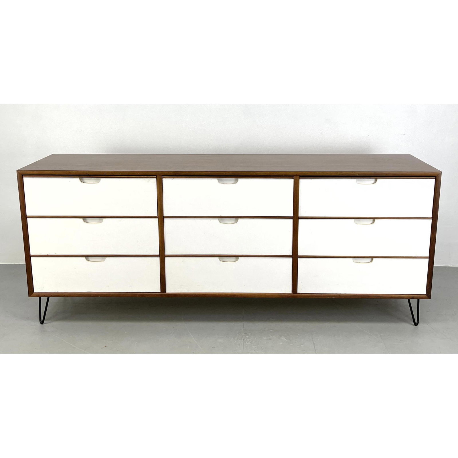 Modernist Laminate Triple Dresser with hairpin legs. Painted front.: Modernist Laminate Triple Dresser with hairpin legs. Painted front. Dimensions: H: 29 inches: W: 71 inches: D: 18 inches ---