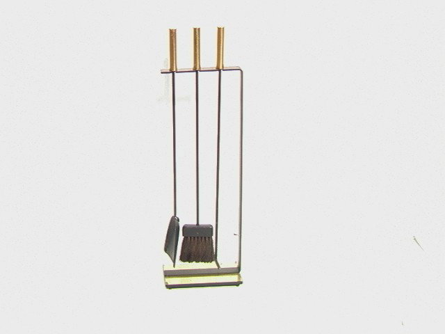Moderne Brass and Iron Fireplace Tool Set. Linea: Moderne Brass and Iron Fireplace Tool Set. Linear Frame with three hanging tools. Brass Accent Base and Handles. -- Dimensions: H: 33 inches: W: 11 inches: D: 6 inches --- Condition (General): Minor w
