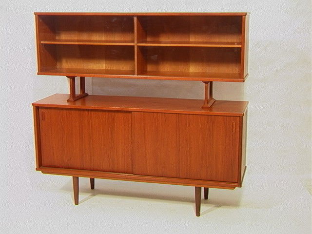 Danish Modern MCM Teak 2 Piece Sideboard Credenza: Danish Modern MCM Teak 2 Piece Sideboard Credenza. Glass Door Front Top. Sliding Wood Doors with interior shelves and drawer. Supported on Peg legs. Tagged Dyrlund Smith, Made in Denmark. -- Dimension