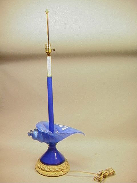 Cobalt Art Glass Shell Form Table Lamp. MURANO H: Cobalt Art Glass Shell Form Table Lamp. MURANO Heavy cased Glass Shell Form. Glass is in 3 sections. Metal Leaf Design Base.-- Dimensions: --- Condition (General): Stem needs to be tightened. Very Goo