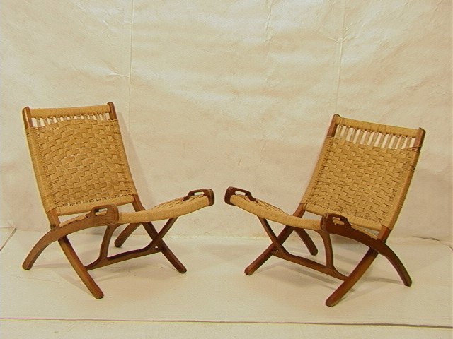 Pair of Hans Wegner Style Folding Lounge Chairs.: Pair of Hans Wegner Style Folding Lounge Chairs. Woven seat & back. Unmarked.-- Dimensions: H: 29 inches: W: 30 inches: D: 24 inches --- Condition (General): Minor scuffs. Please contact us with speci