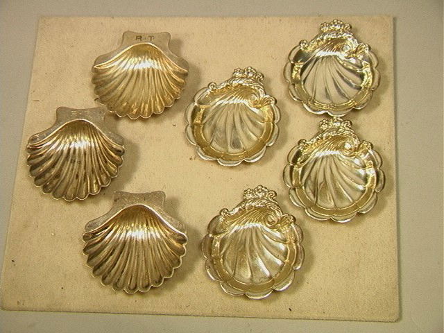Sterling Nut Dishes Lot. Three (3) Matching Shell: Sterling Nut Dishes Lot. Three (3) Matching Shell Form. Four (4) Matching Floral Form. All marked. 7 PCS.-- Dimensions: H: 2 inches--- Weight: 5.6 Troy ozs. ---- --- Condition (General): Shell Form ar
