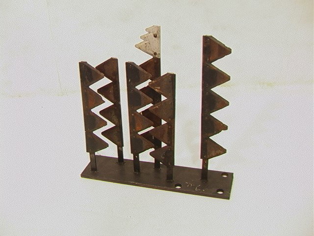 Mathias Goeritz Found Art Blade Sculpture. Angul: Mathias Goeritz Found Art Blade Sculpture. Angular pieces on steel base. Signed.-- Dimensions: H: 19 inches: W: 19.5 inches: L: 5 inches --- Condition (General): some rust Please contact us with speci