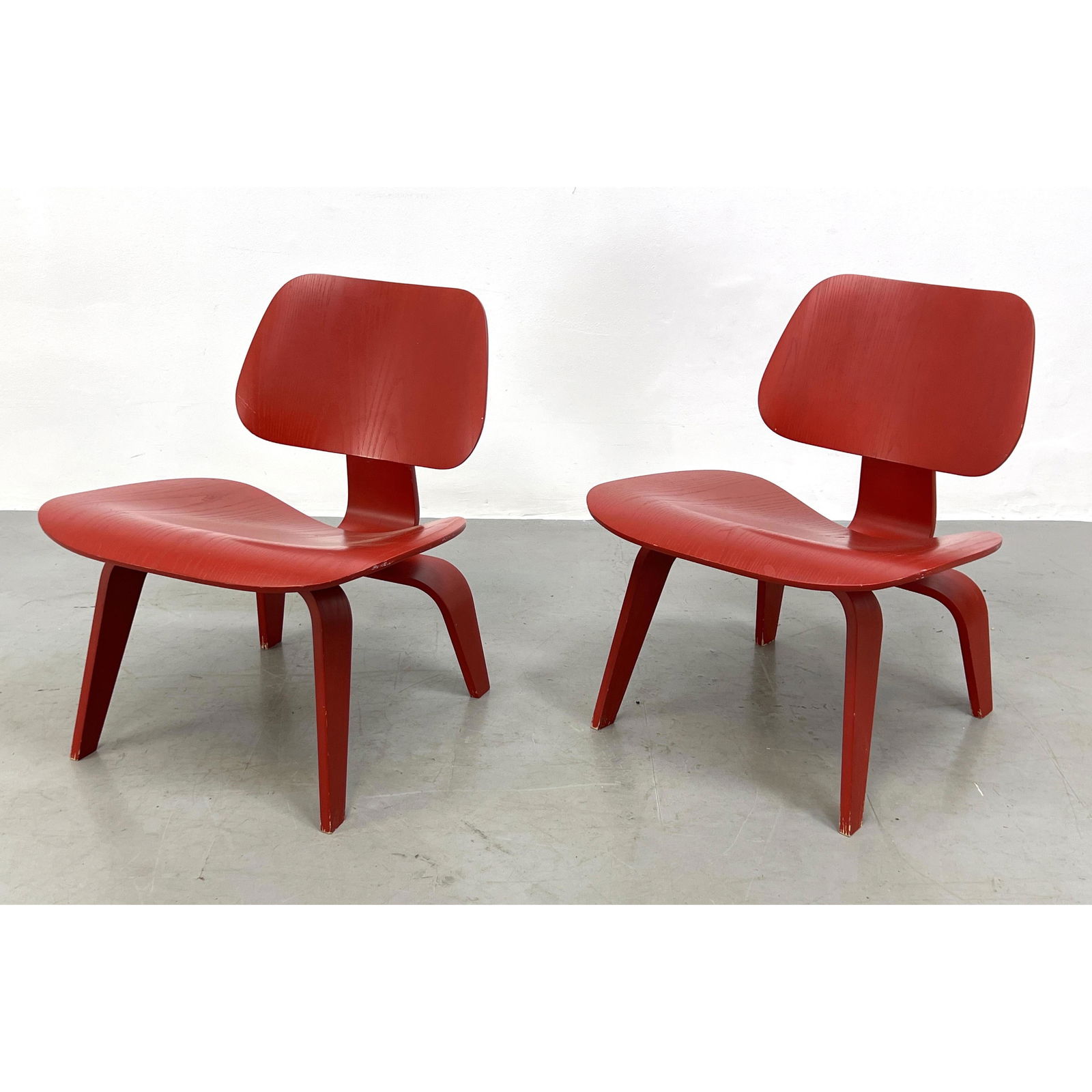 Pair of Red Herman Miller Eames chairs LCW. Labeled. (1 of 13)