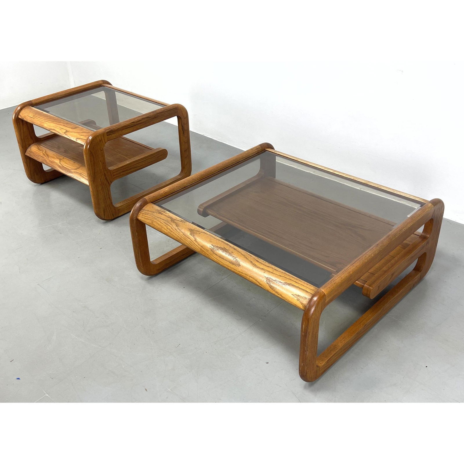 2pc Lou Hodges Oak and glass cocktail and end table set. Smoked glass. Smaller table 20.5" 28" 28" (1 of 12)