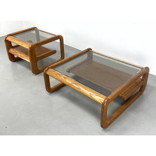 2pc Lou Hodges Oak and glass cocktail and end table set. Smoked glass. Smaller table 20.5" 28" 28": 2pc Lou Hodges Oak and glass cocktail and end table set. Smoked glass. Smaller table 20.5" 28" 28" Dimensions: H: 16 inches: W: 39 inches: D: 38 inches ---