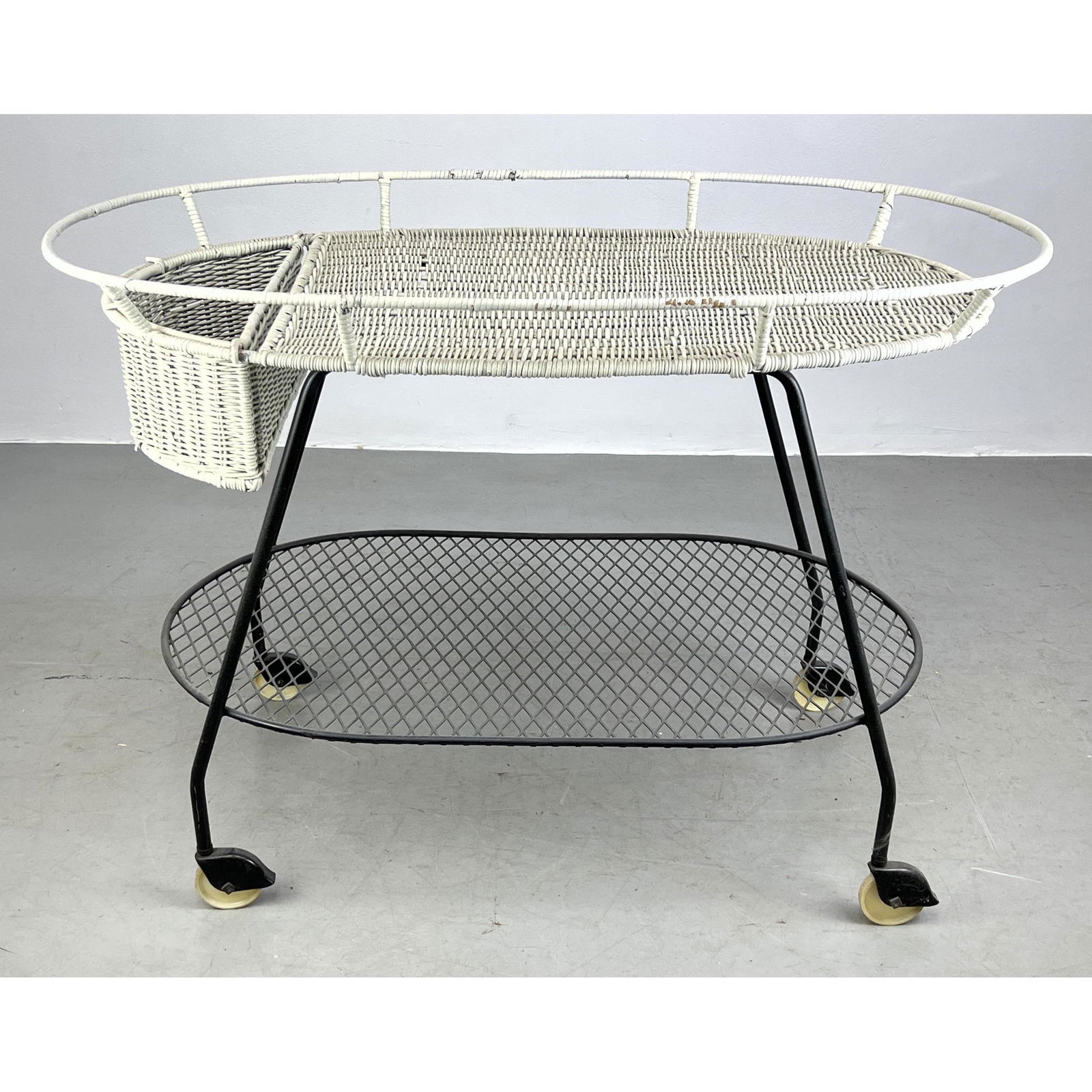 Vintage bar cart by Salterini. White painted wicker top and basket over black steel frame. On caster (1 of 9)
