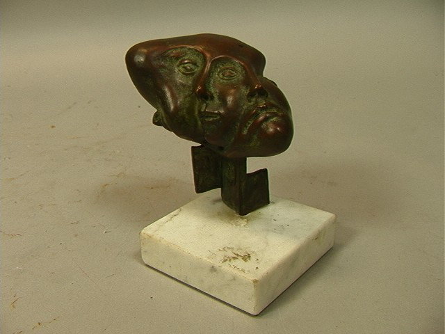 Roberto Montenegro Small Bronze Sculpture. Surre: Roberto Montenegro Small Bronze Sculpture. Surreal Faces. Signed. White marble base.-- Dimensions: H: 4.25 inches: W: 3 inches: D: 4 inches --- Condition (General): Very Good Condition. Please contact